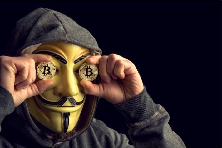 a person wearing a mask holding two coins